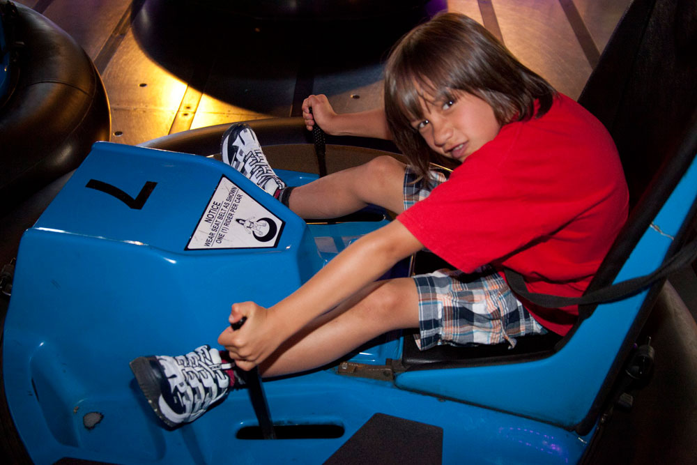 Young Guest On Bumper Cars Attraction