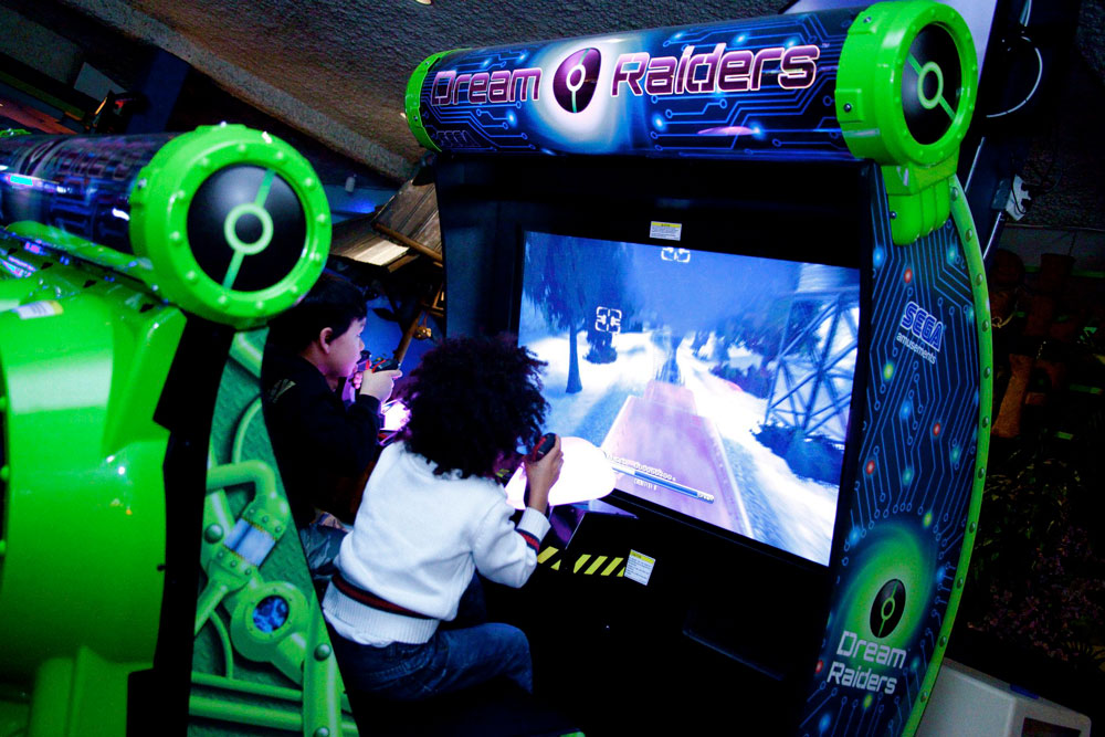 Guests On Dream Raiders Arcade Attraction
