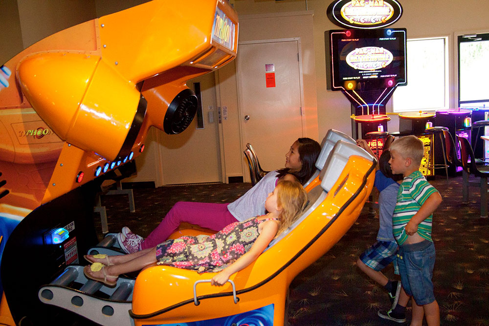 Guests On Typhoon Arcade Attraction